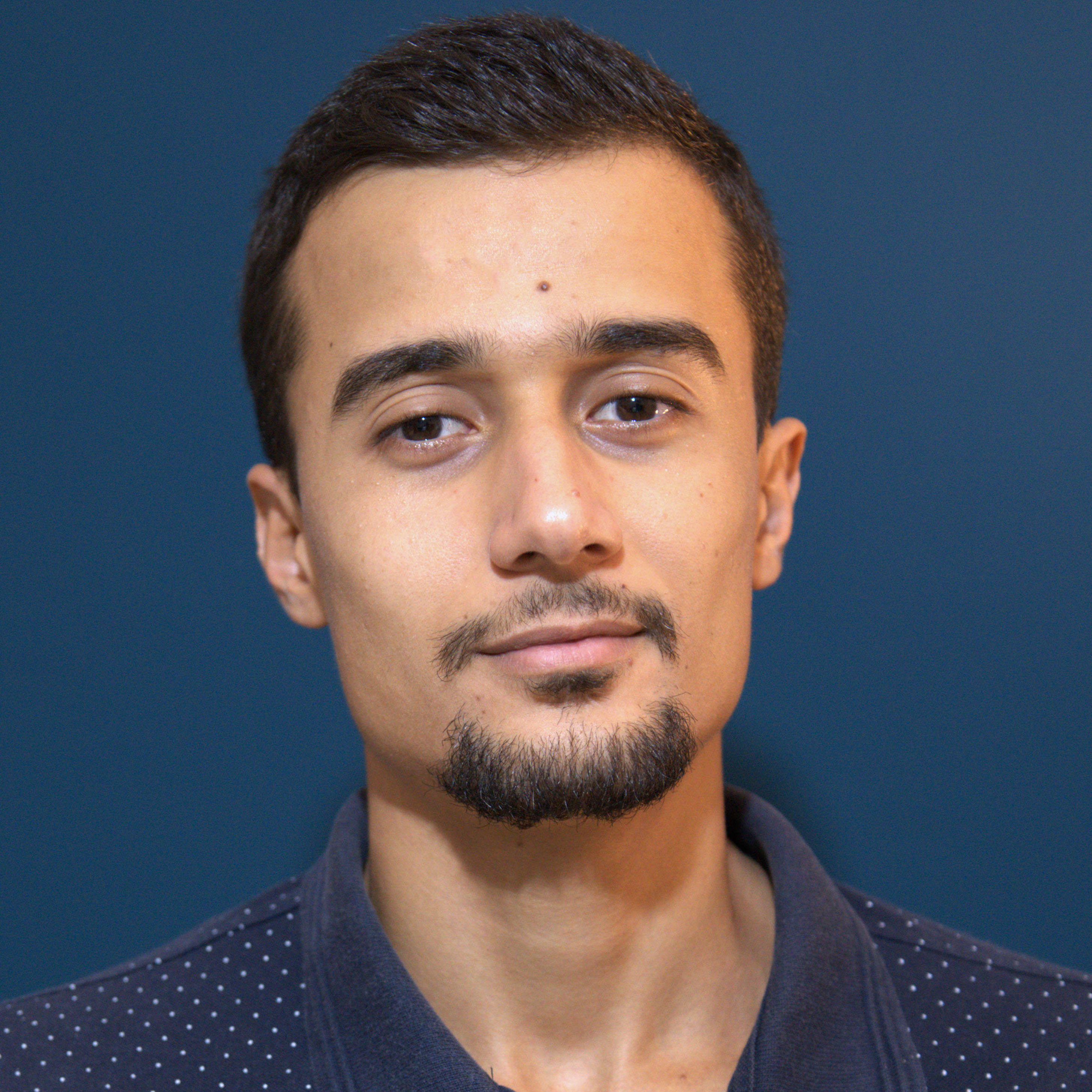 A professional headshot of Hamza Boulahia